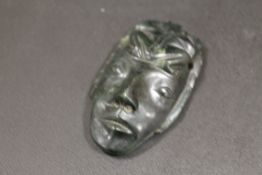 A JADE PENDANT IN THE FORM OF A FACE MASK - WITH SOME REPAIR