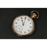 AN OPEN FACED MANUAL WIND GOLD PLATED POCKET WATCH