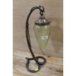 A HANDMADE IRONWORK TABLE LAMP WITH SUSPENDED CUT GLASS SHADE