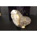 A ROYAL CROWN DERBY PAPERWEIGHT IN THE FORM OF A WALRUS - WITH BOX