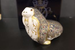 A ROYAL CROWN DERBY PAPERWEIGHT IN THE FORM OF A WALRUS - WITH BOX