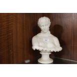A SMALL ALABASTER STYLE BUST OF A LADY