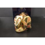 A ROYAL CROWN DERBY PAPERWEIGHT IN THE FORM OF AN OLD IMARI SNAKE - WITH BOX