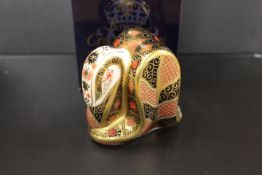 A ROYAL CROWN DERBY PAPERWEIGHT IN THE FORM OF AN OLD IMARI SNAKE - WITH BOX