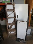A SET OF VINTAGE WOODEN STEP LADDERS WITH A FOUR WHEEL SACK TROLLEY