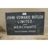 A VINTAGE METAL SIGN 'JOHN EDWARD BUTLER MERCHANTS'