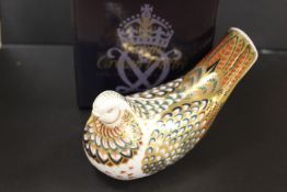 A ROYAL CROWN DERBY PAPERWEIGHT IN THE FORM OF A TURTLE DOVE - WITH BOX