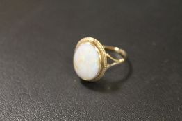 A HALLMARKED GOLD OPAL RING