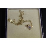 A HALLMARKED 10ct GOLD DIAMOND CLUSTER PENDANT NECKLACE