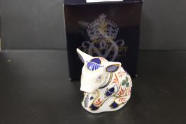 A ROYAL CROWN DERBY PAPERWEIGHT IN THE FORM OF A SITTING PIGLET