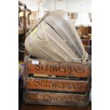 A VINTAGE WOODEN SCHWEPPES CRATE TOGETHER WITH A WICKER STYLE BASKET