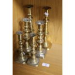 THREE PAIRS OF BRASS CANDLESTICKS LARGEST ONE 26CM