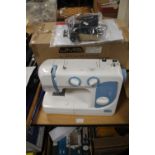 A BOXED JMB ELECTRIC SEWING MACHINE WITH POWER LEAD A/F