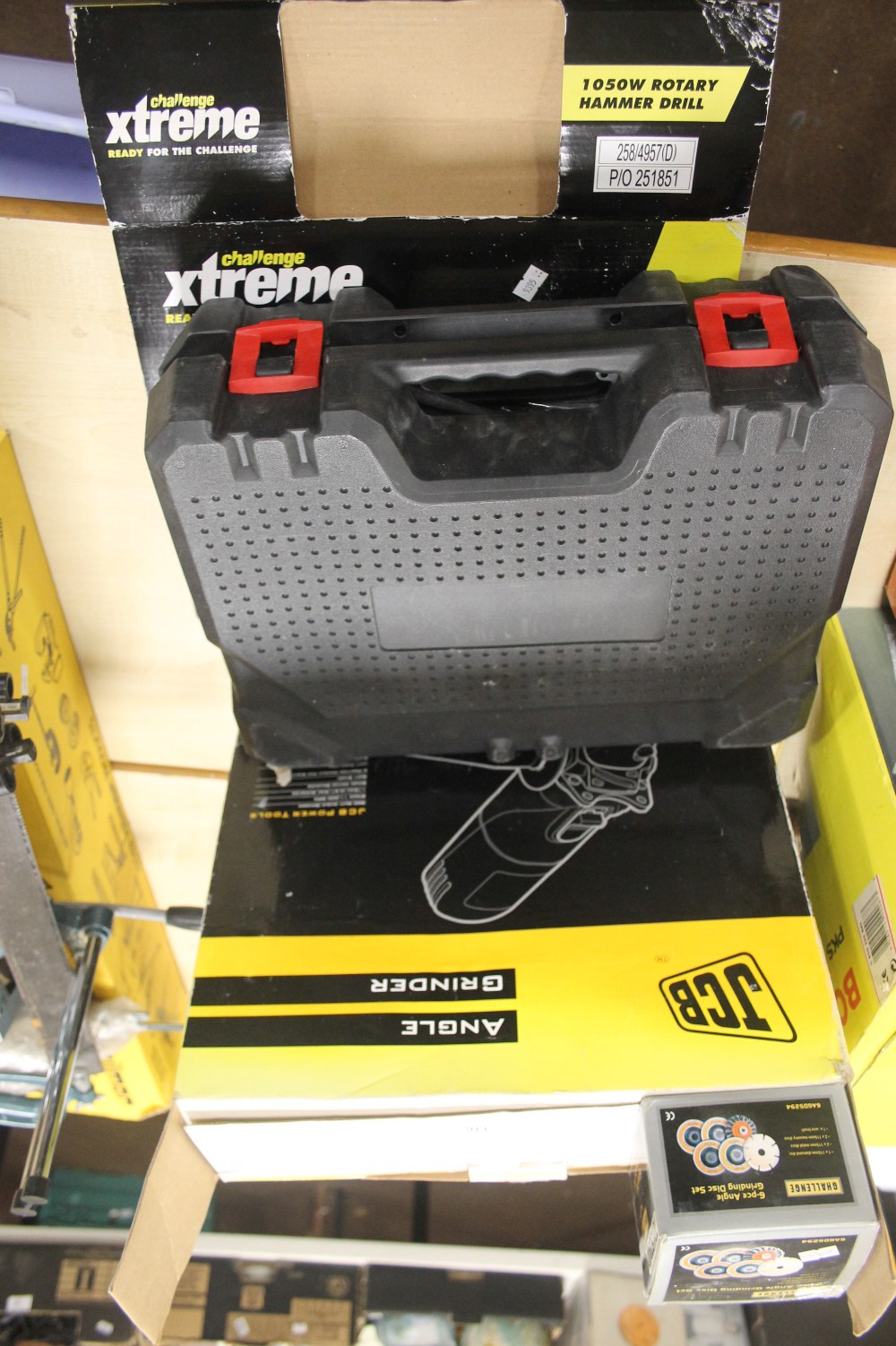 A CHALLENGE EXTREME 1050W ROTERY HAMMER DRILL TOGETHER WITH A JCB 860W ANGEL GRINDER AND SIX PIECE