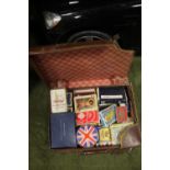 A LEATHER CASE CONTAINING PACKS OF PLAYING CARDS, GLAMOUR CARDS INCLUDED