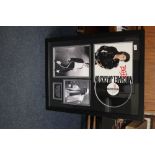 A MICHEAL JACKSON KING OF POP FRAMED PHOTOGRAPH AND A BAD ALBUM COVER AND VINYL