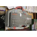 A SINCLAIR ZX SPECTRUM COMPUTER WITH A BAG OF GAMES