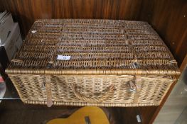 A WICKER PICNIC BASKET AND CONTENTS