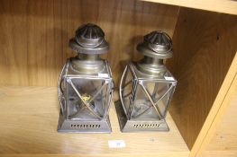 A PAIR OF HANGING BRASS AND GLASS LIGHT FITTINGS