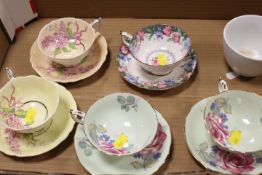 A SMALL TAY OF ASSORTED CUPS AND SAUCERS