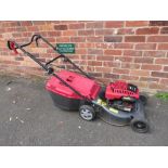 A MOUNTFIELD 24-3881 PETROL DRIVEN LAWNMOWER WITH GRASS BOX