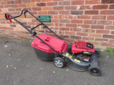 A MOUNTFIELD 24-3881 PETROL DRIVEN LAWNMOWER WITH GRASS BOX