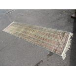 A VINTAGE WOOLLEN RUG APPROX 290 x 80 cm