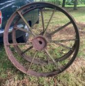 A DECORATIVE PAIR OF LARGE CAST IRON WHEELS