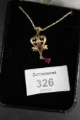A HALLMARKED 9CT GOLD GEMSET PENDANT AND CHAIN - APPROX WEIGHT 5.5 G