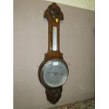 A SMALL OAK BAROMETER S/D