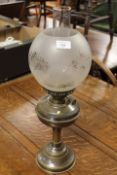 A VINTAGE OIL LAMP WITH ETCHED GLASS SHADE