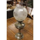 A VINTAGE OIL LAMP WITH ETCHED GLASS SHADE