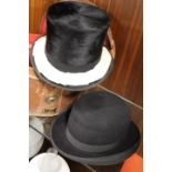 THREE VINTAGE HATS TO INCLUDE A TOP HAT AND A BOWLER HAT IN A LEATHER HAT BOX
