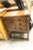 A SMALL OAK REPRODUCTION CABINET WITH DRAWERS