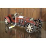 A VINTAGE TIN PLATE CAR MARKED TO BASE ME395