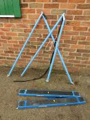 A PAIR OF DRAPER TR2 FOLDING TRESTLE TABLES WITH TWO ANKALAD LADDERS STABILISERS