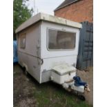 A VINTAGE MIDWAY COBUR TRAILER TENT WITH CONTENTS