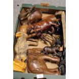 A QUANTITY OF CARVED WOODEN AFRICAN ANIMALS ETC