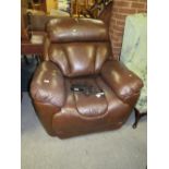 A BROWN LEATHER ELECTRIC ARMCHAIR