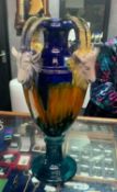 AN ATTRACTIVE BLUE AND WHITE AMBER GRAND VASE WITH RAMS HEAD MASKS IN THE ITALIAN MAJOLICA
