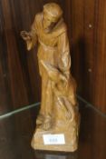 A CARVED WOODEN RELIGIOUS FIGURE OF FRANCIS OF ASSISI