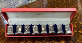A BOXED SET OF EIGHT SILVER CARTIER PEPPERS MARKED 'CARTIER STERLING'