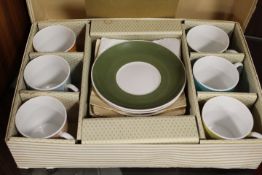 A SET OF SUSIE COOPER CUPS AND SAUCERS IN ORIGINAL BOX