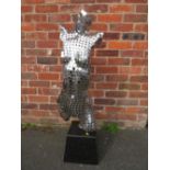 A MODERN SCULPTURE OF A FEMALE TORSO MADE FROM STAINLESS STEEL DISCS MOUNTED ON A MARBLED BASE H 109