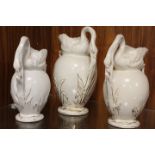 A SET OF THREE GRADUATING ANTIQUE SWAN JUGS