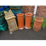 A SELECTION OF TERRACOTTA CHIMNEY POTS