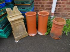 A SELECTION OF TERRACOTTA CHIMNEY POTS