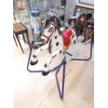 A 1950s CHILDS SPRUNG METAL ROCKING HORSE