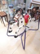 A 1950s CHILDS SPRUNG METAL ROCKING HORSE