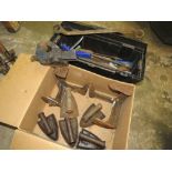 A PLASTIC TOOLBOX WITH VARIOUS TOOLS TOGETHER WITH STEEL HAND IRONS, COBBLERS LASTS AND VICE